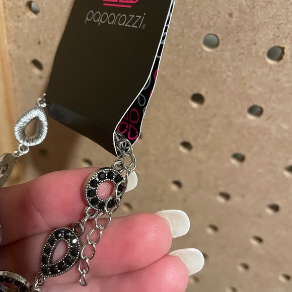 Delicate silver bracelet with teardrop and circular shapes w/black rhinestones. - Picture 2 of 3